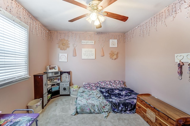 bedroom with light carpet and ceiling fan