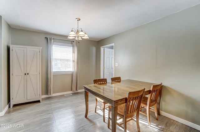 dining area featuring a chandelier