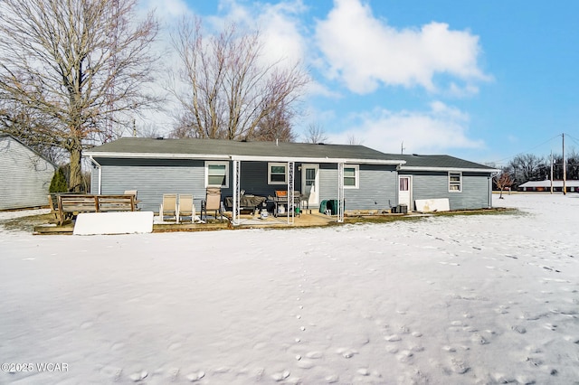 view of snow covered house