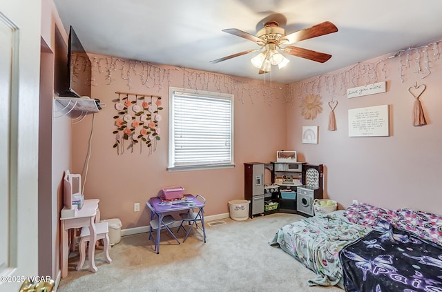 carpeted bedroom with ceiling fan