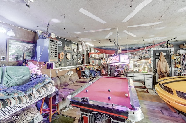 recreation room featuring billiards, a workshop area, and wood-type flooring