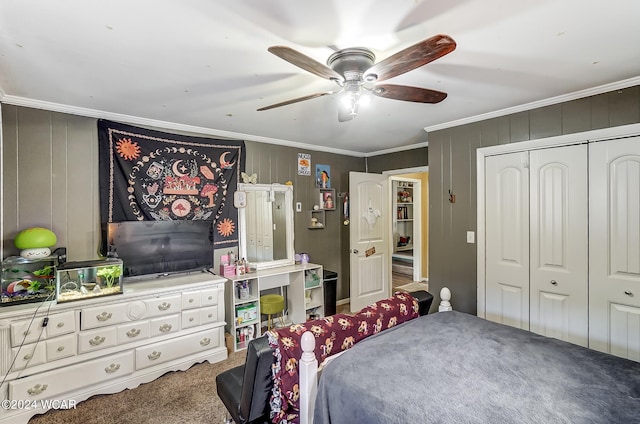 carpeted bedroom featuring a closet, crown molding, and ceiling fan