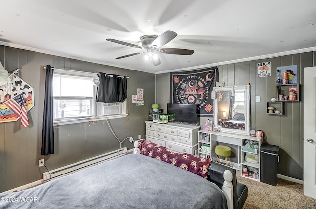 bedroom with cooling unit, baseboard heating, ornamental molding, ceiling fan, and carpet flooring