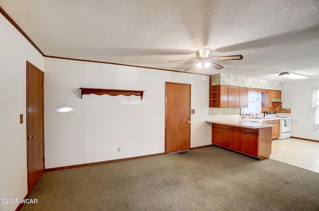 kitchen featuring white electric range, ornamental molding, a textured ceiling, light colored carpet, and kitchen peninsula