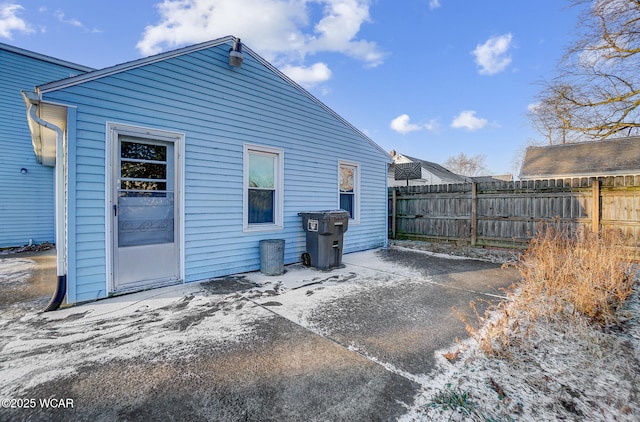 back of property with a patio