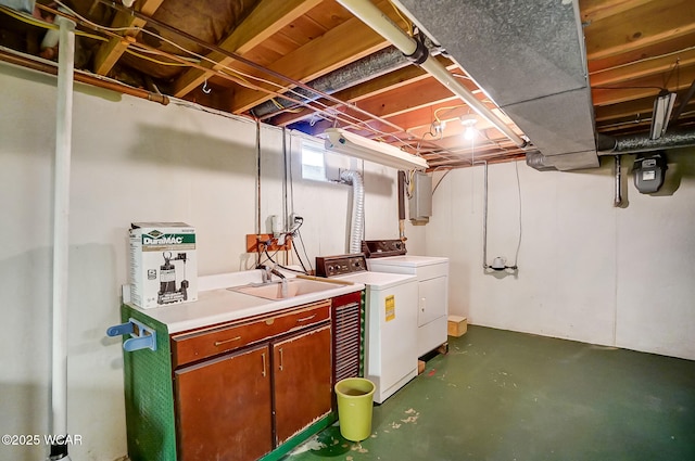 basement featuring sink and washer and clothes dryer