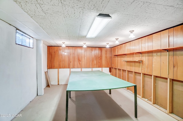 playroom featuring wooden walls