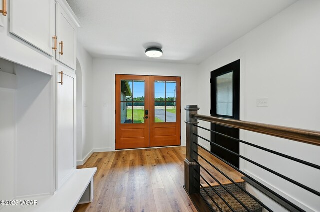 3485 Sugar Creek Rd, Lima, OH 45807 - mudroom with light wood-style flooring and french doors