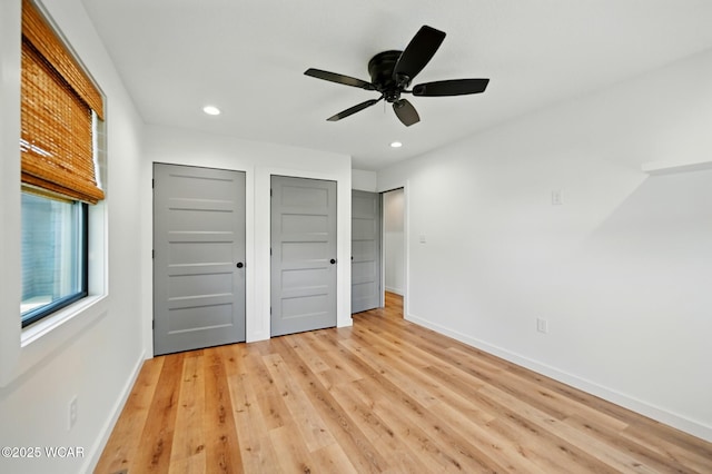 3485 Sugar Creek Rd, Lima, OH 45807 - unfurnished bedroom with recessed lighting, light wood finished floors, two closets, and ceiling fan