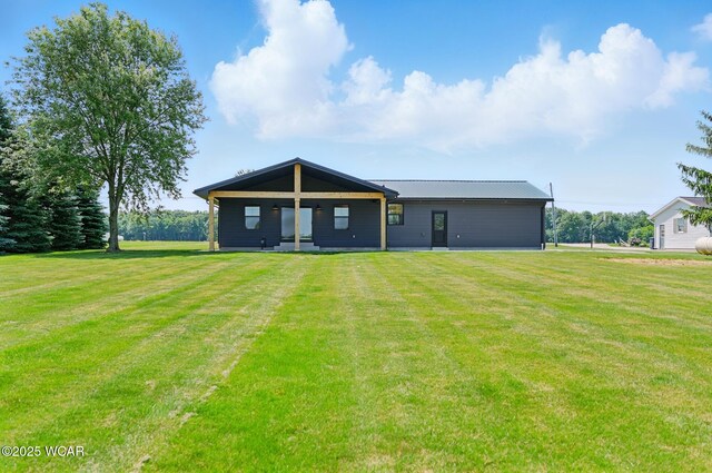 3485 Sugar Creek Rd, Lima, OH 45807 - rear view of house featuring a lawn