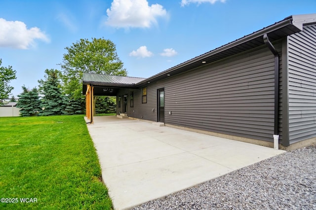 3485 Sugar Creek Rd, Lima, OH 45807 - view of side of home with a lawn and a metal roof