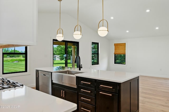3485 Sugar Creek Rd, Lima, OH 45807 - kitchen with light countertops, stainless steel dishwasher, light wood-type flooring, recessed lighting, and a center island with sink