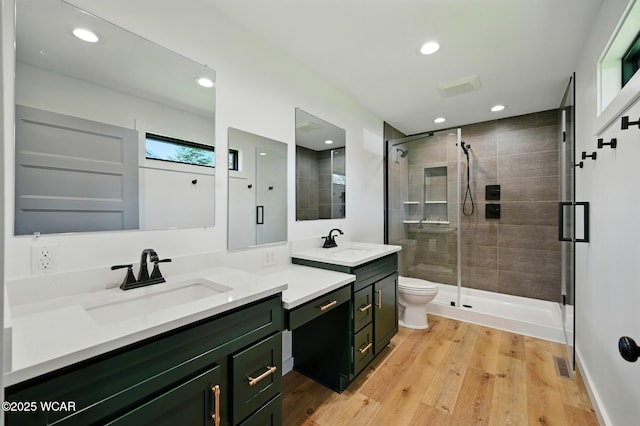3485 Sugar Creek Rd, Lima, OH 45807 - full bathroom featuring vanity, a shower stall, recessed lighting, and wood finished floors