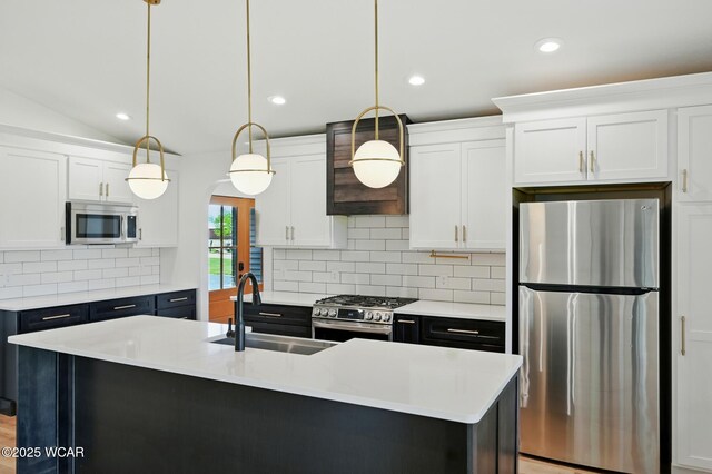 3485 Sugar Creek Rd, Lima, OH 45807 - kitchen with appliances with stainless steel finishes, white cabinets, light countertops, decorative light fixtures, and recessed lighting