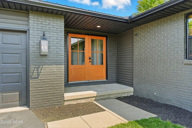 3485 Sugar Creek Rd, Lima, OH 45807 - view of exterior entry featuring a garage and brick siding