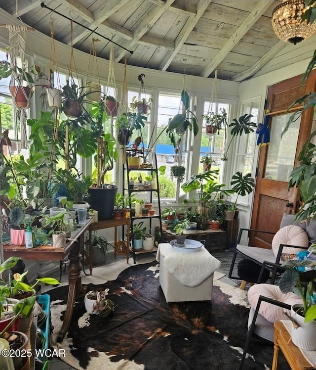 sunroom / solarium with vaulted ceiling with beams and wood ceiling