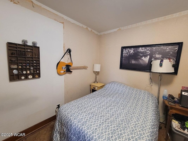 bedroom featuring baseboards and ornamental molding