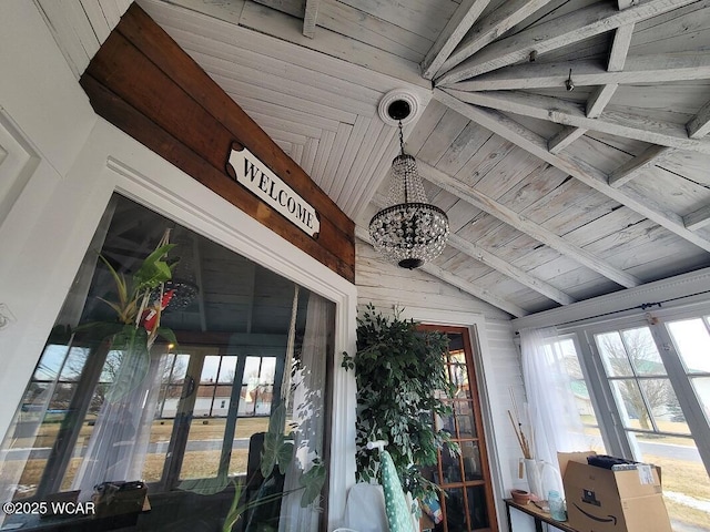 details with wooden ceiling, beam ceiling, and a notable chandelier