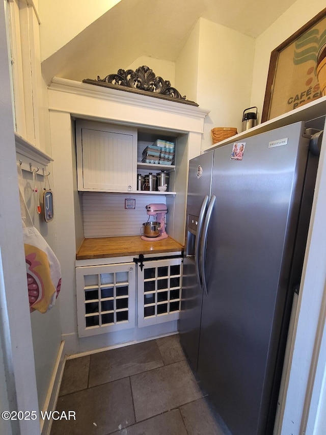 kitchen with stainless steel refrigerator with ice dispenser