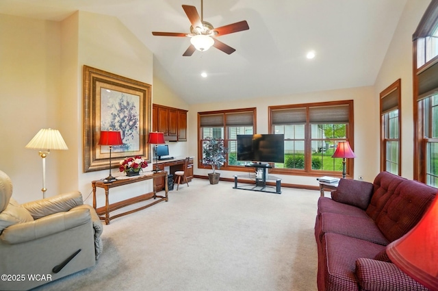 living area with light colored carpet, plenty of natural light, ceiling fan, and recessed lighting