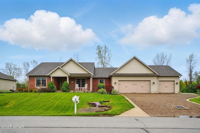 craftsman-style house with covered porch, an attached garage, brick siding, driveway, and a front yard