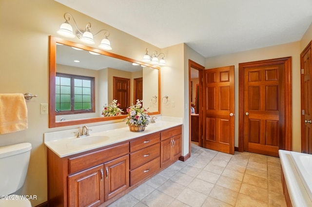 full bathroom with a sink, double vanity, toilet, and a bathtub