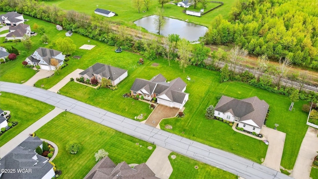 bird's eye view with a water view and a residential view