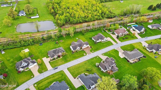 aerial view featuring a water view and a residential view