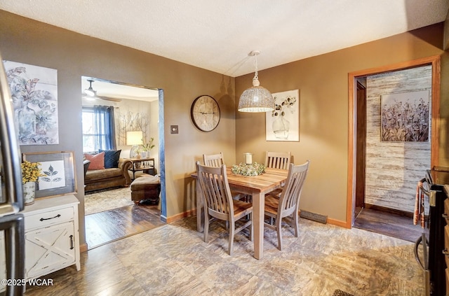 dining area featuring baseboards