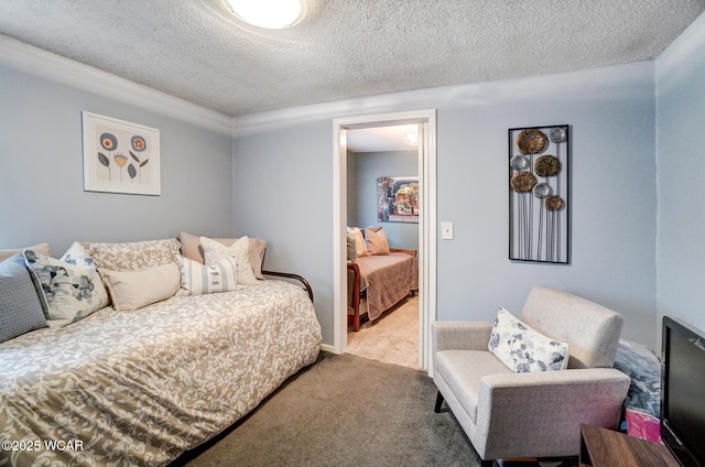 bedroom with a textured ceiling and carpet