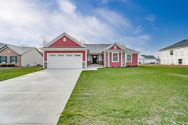 view of front facade with stone siding, concrete driveway, an attached garage, and a front lawn