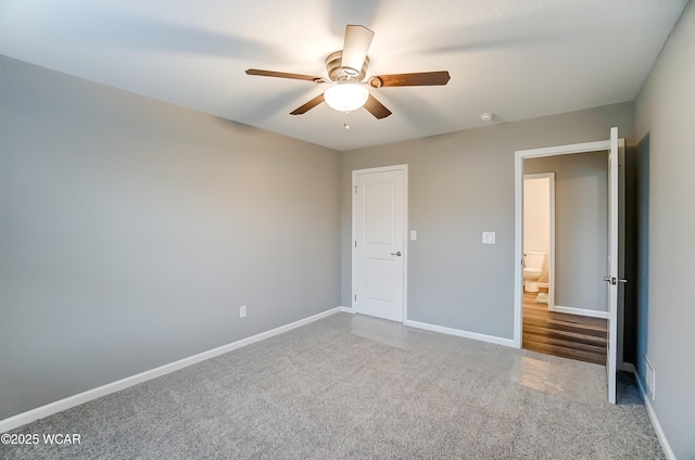 unfurnished bedroom with ceiling fan, baseboards, and carpet flooring