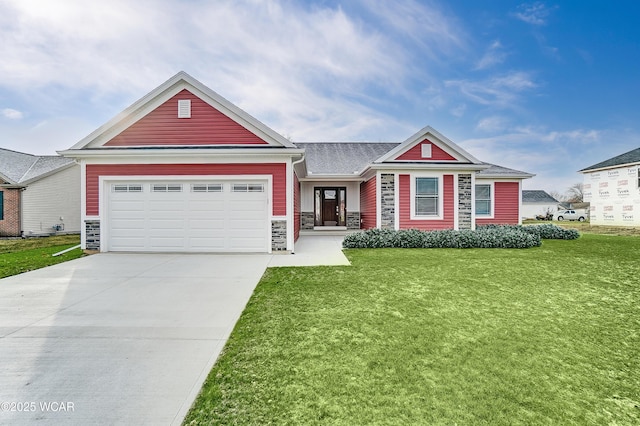 view of front of home with a garage, a front yard, and concrete driveway