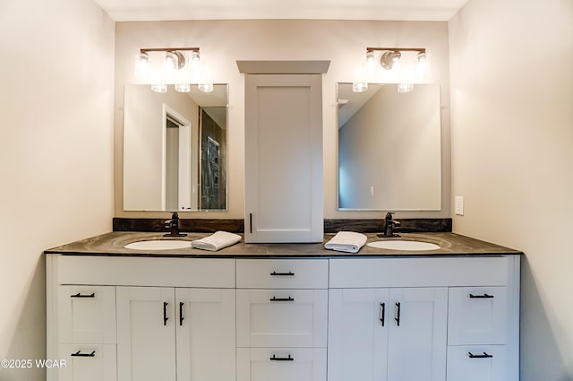 bathroom featuring double vanity and a sink