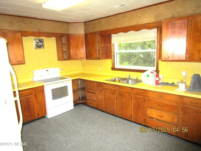 16255 Elevator Rd, Street, Forest, OH 45843 - kitchen with white appliances, brown cabinets, and light countertops