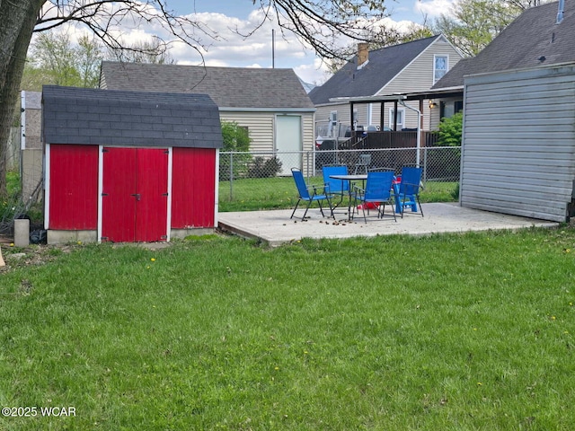 664 Cortlandt Ave, Lima, OH 45801 - view of yard with an outdoor structure, fence, a patio area, and a storage shed