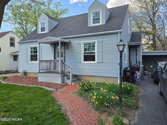 664 Cortlandt Ave, Lima, OH 45801 - cape cod house with a front lawn and roof with shingles