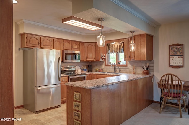 kitchen featuring a sink, a peninsula, crown molding, decorative backsplash, and appliances with stainless steel finishes