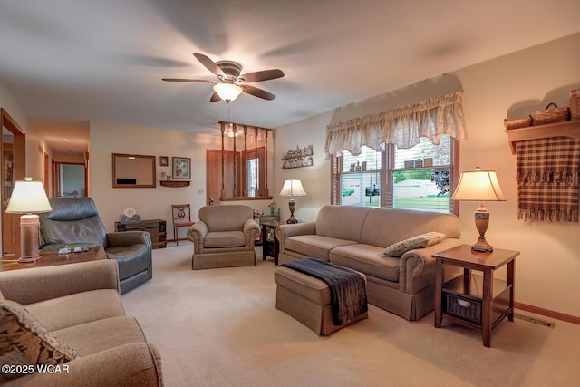 carpeted living area featuring visible vents and ceiling fan