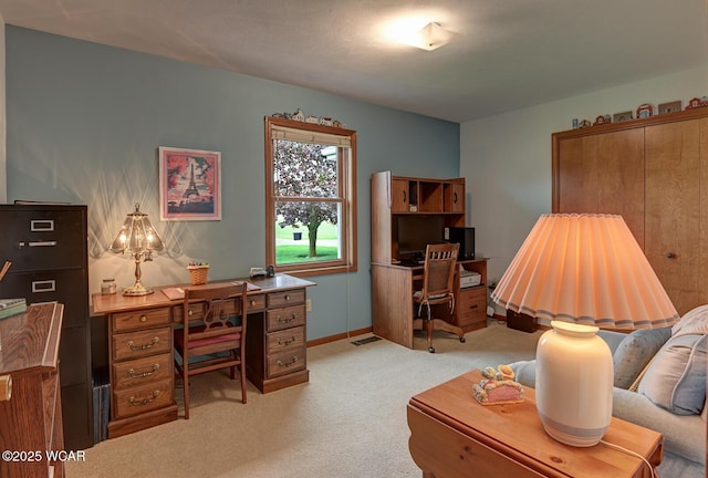 office featuring light colored carpet and baseboards