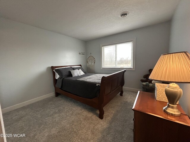 2275 N Cable Rd Unit 60, Lima, OH 45807 - bedroom with baseboards, a textured ceiling, visible vents, and carpet