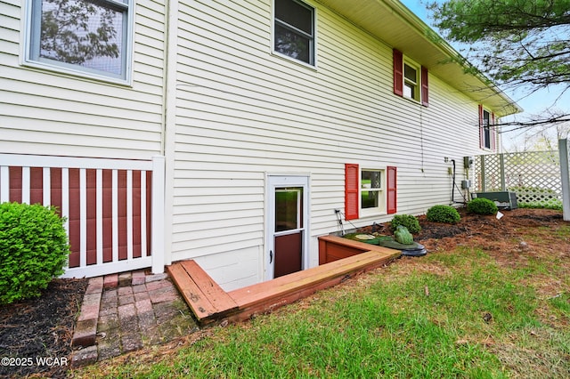 rear view of house with cooling unit