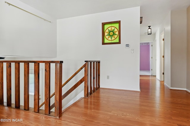 interior space with light wood-style floors and baseboards