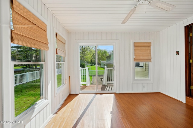 unfurnished sunroom with wood finished floors