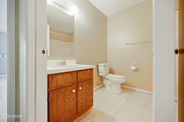 bathroom featuring walk in shower, tile patterned flooring, vanity, toilet, and baseboards