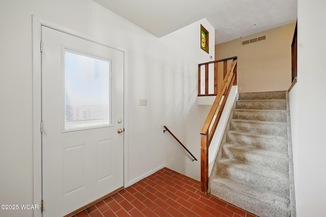 interior space with brick patterned floor and visible vents