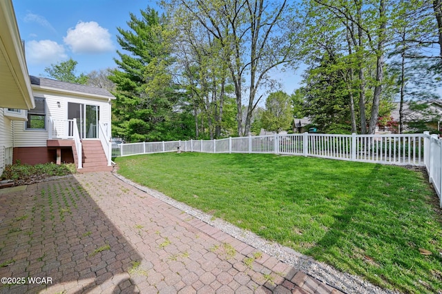view of yard with a patio and a fenced backyard