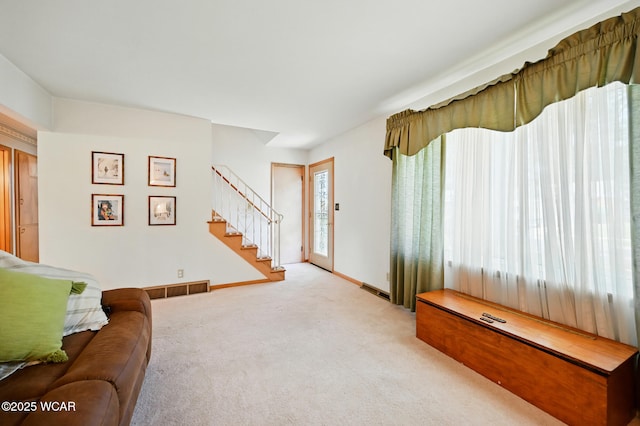 1317 Melrose St, Lima, OH 45801 - living area featuring stairway and carpet