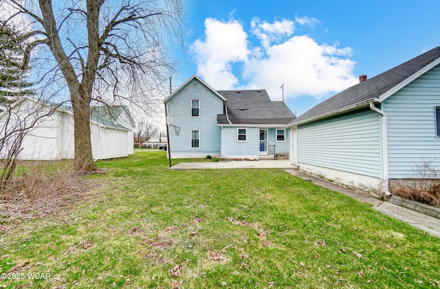 rear view of property with a yard