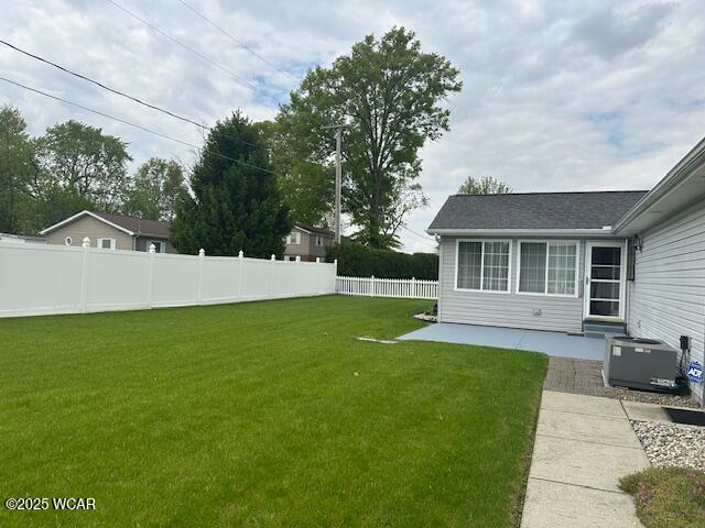 1461 Cessna Ave, Lima, OH 45807 - view of yard featuring central AC unit and a patio area
